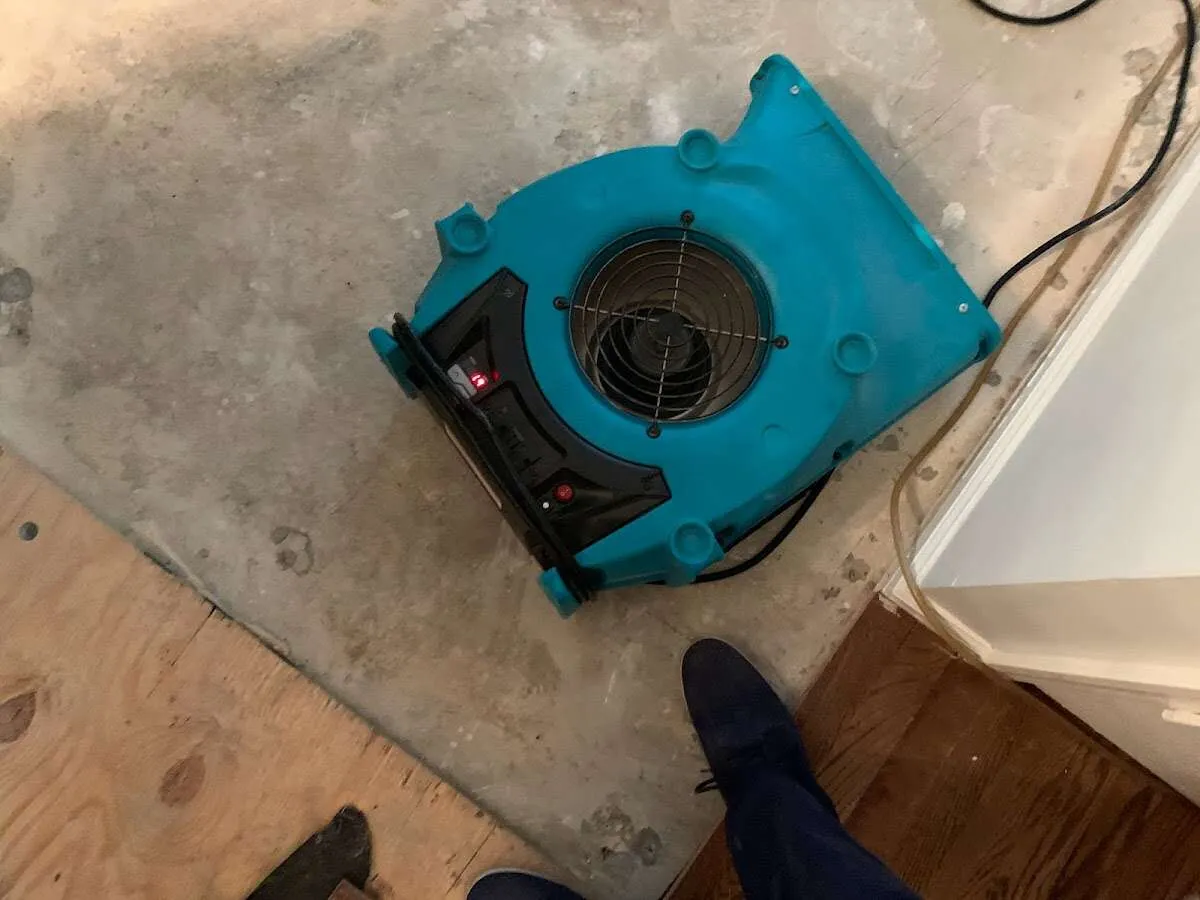 Air mover drying subfloor during Leak Detection & Repair in West Brandywine